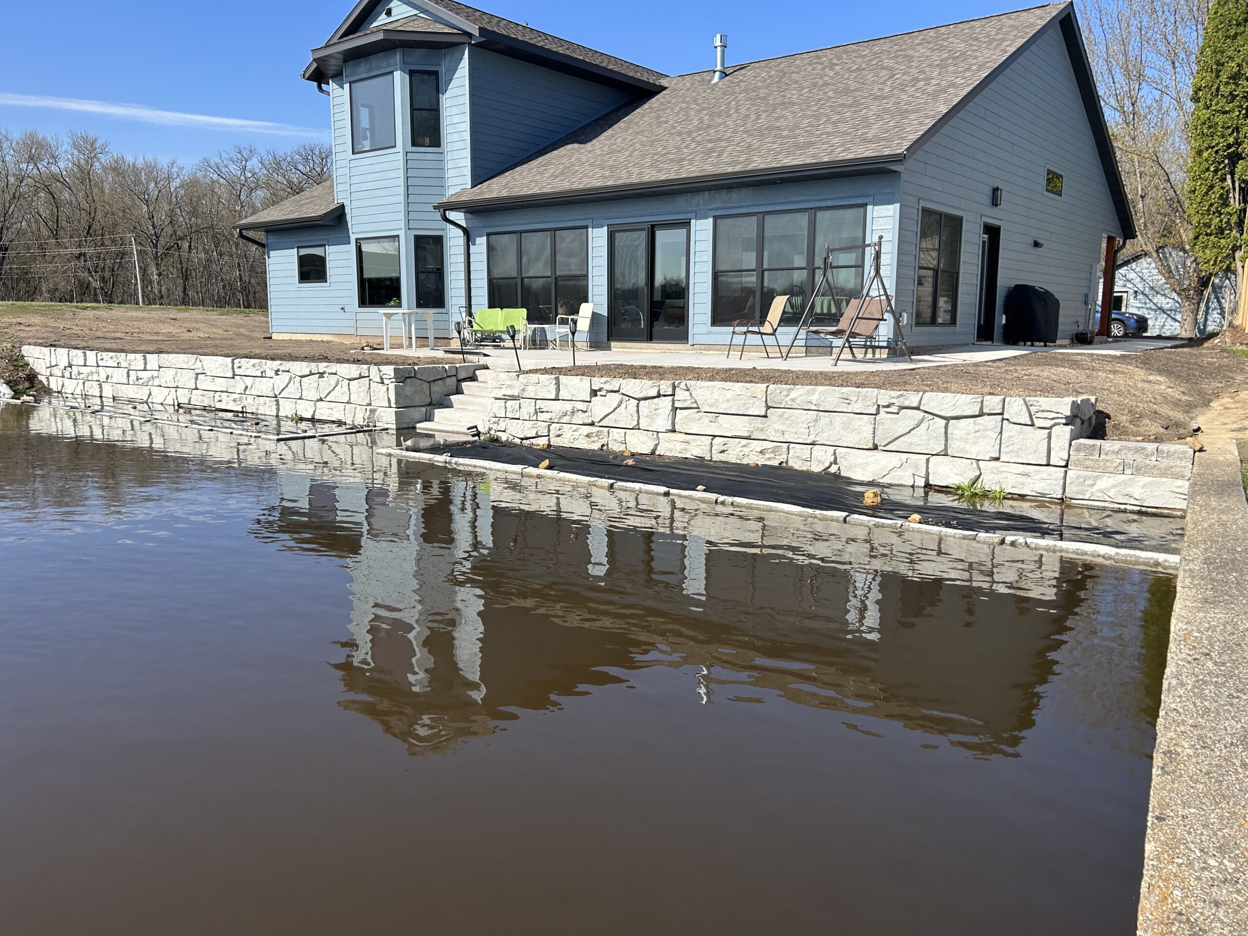 Riverfront Wall Build - excavation project by Coulee Country Excavating in West Salem, WI